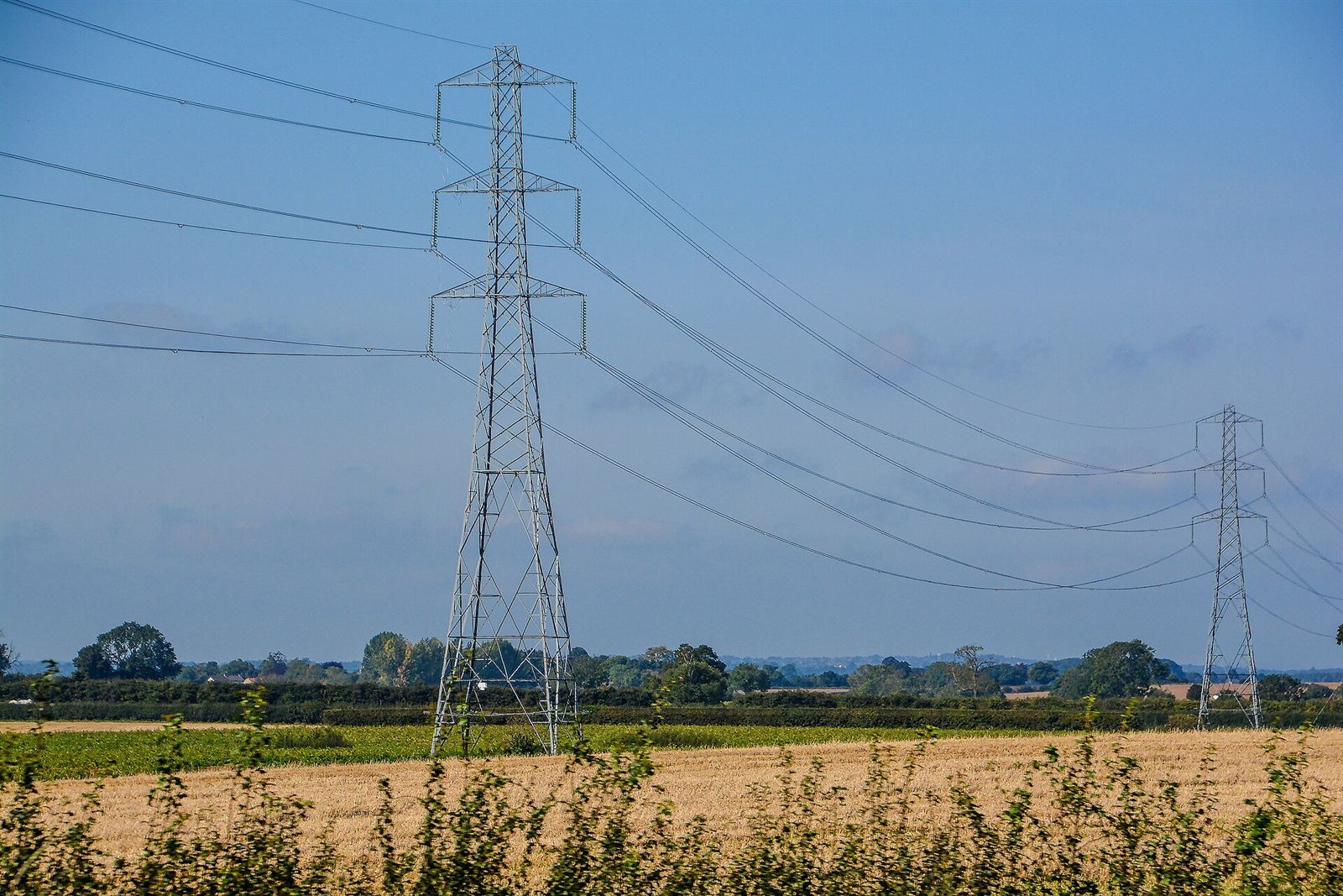 Pylons and power lines over fields at Kirk Deighton, Yorkshire