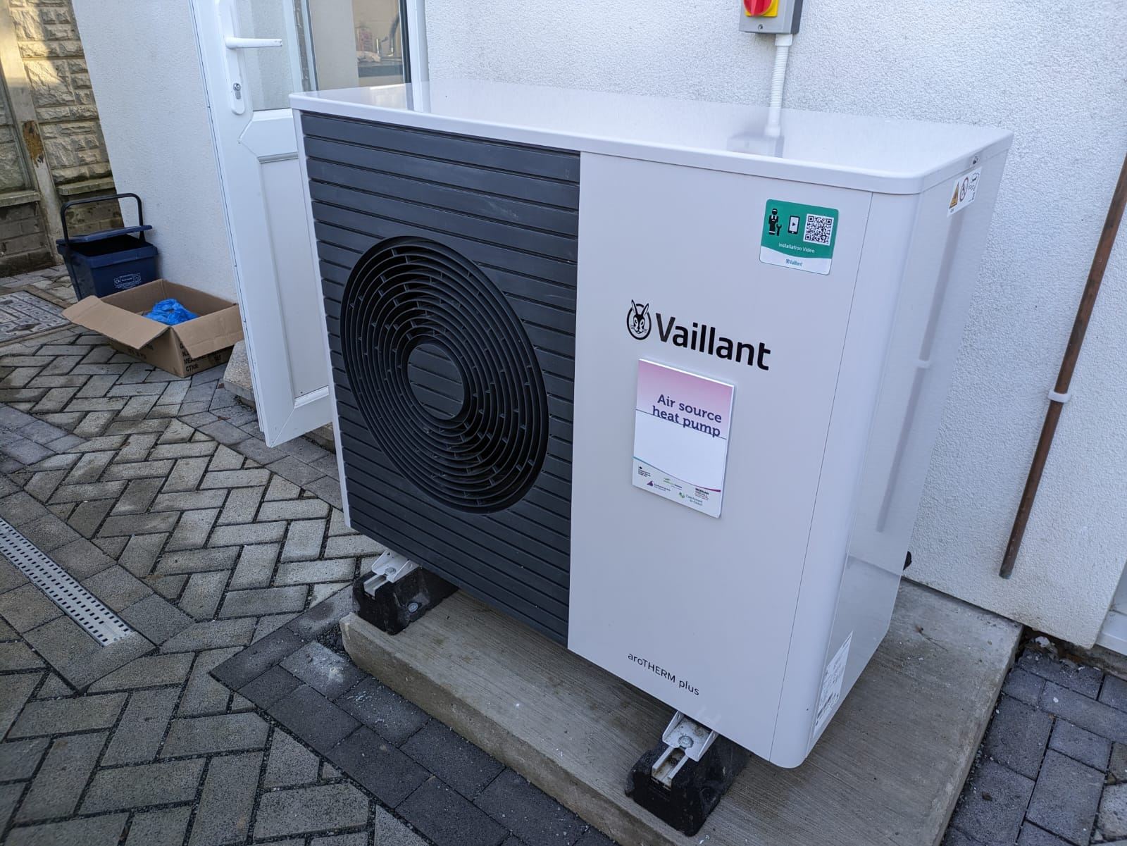An air source heat pump outside a terraced house